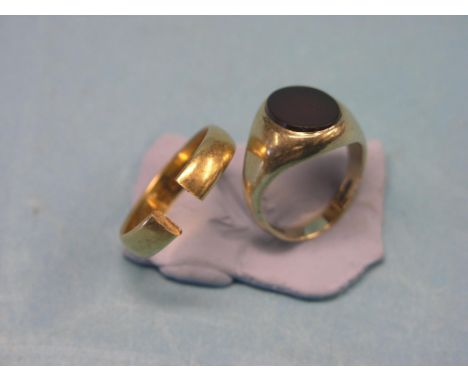 A 9ct. gold signet ring, inset with red stone, and a damaged 22ct. gold wedding ring, latter 5 grams 