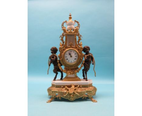 A classical-style ormolu mantel clock, with centaur surmounts, lyre-shape on white marble plinth, with key, 24in.