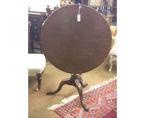 A George III mahogany tilt-top table, circular top on urn-shape pedestal with tripod base, top 2ft. 7in.