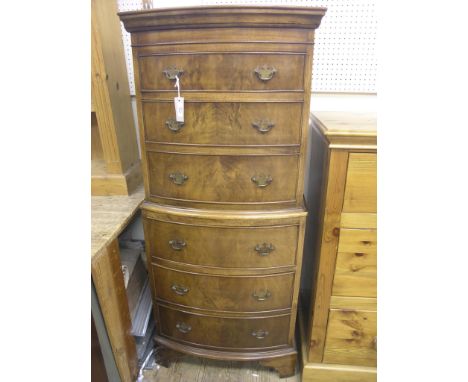 A walnut tallboy, bow-fronted with six burr-veneered drawers, 2ft. 2in. wide 