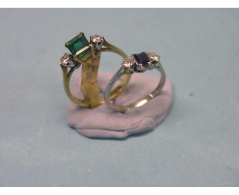 A platinum diamond and sapphire half-hoop ring and an 18ct. gold diamond and emerald ring