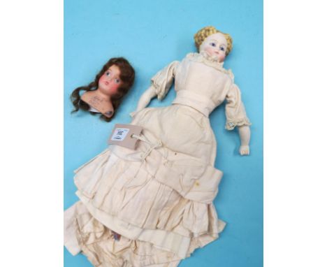 A late 19th century German shoulder-bisque doll, with ceramic lower-limbs, evening dress, 13in. and a shoulder-bisque doll he