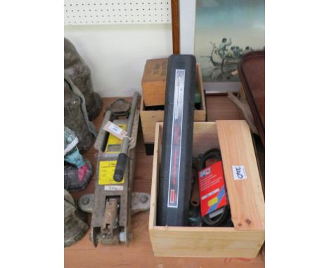 A two-ton trolley jack, cased torque wrench, fishing reels, two old First Aid kits and hand tools