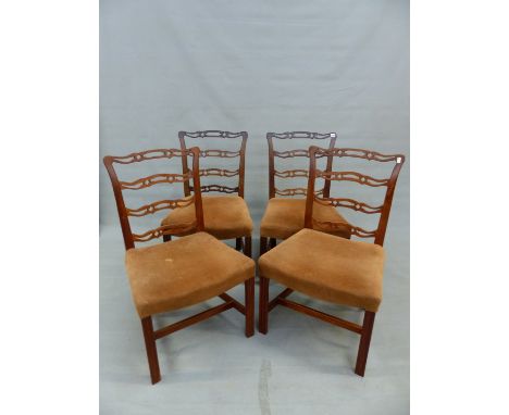 A SET OF FOUR MAHOGANY PIERCED LADDER BACKED CHAIRS, THE UPHOLSTERED SEATS OVER A CHANNELLED FRONT LEGS, TWO GEORGIAN AND TWO
