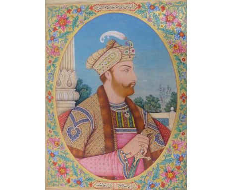 A LARGE 19th.C. INDIAN WATERCOLOUR. AN OVAL PROFILE PORTRAIT OF A PRINCELY RULER HOLDING A SWORD. ELABORATE FLORAL SURROUND. 