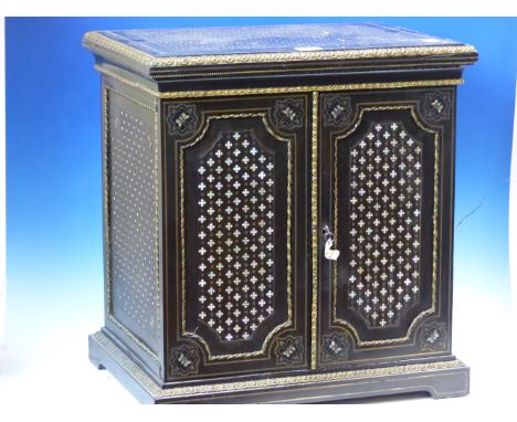 A 19th.C.&nbsp;EBONY BOULLE COLLECTORS CABINET INLAID IN BRASS AND MOTHER OF PEARL WITH A DIAPER OF CROSSES, THE DOORS WITH B