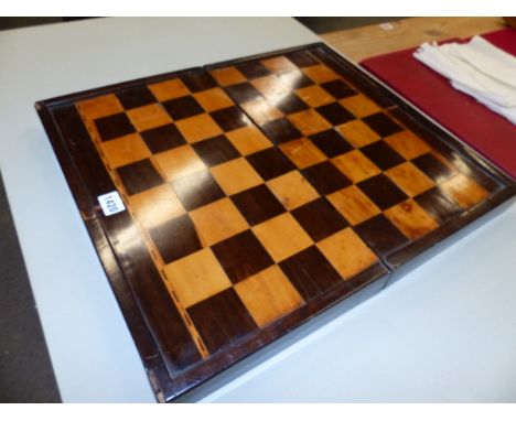 A PARQUETRIED ROSEWOOD FOLDING CHESS AND BACKGAMMON BOARD, THE LATTER WITH ALTERNATING WHITE AND MAUVE POINTS, THE TWO CENTRA