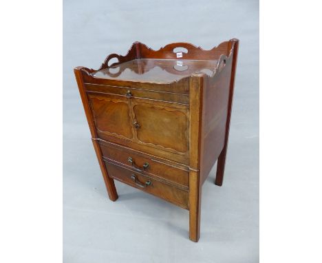 A GEORGE III MAHOGANY BEDSIDE TABLE, THREE HANDLES PIERCED THROUGH THE GALLERIED TOP ABOVE A SHALLOW DRAWER, CUPBOARD AND DRA