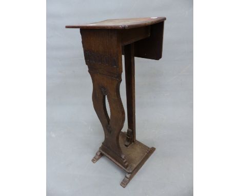 A 19th C. OAK FLAP TOP TORCHERE, A BAND OF FLUTING TO THE APRON ABOVE THE BALUSTER FRONT PIERCED WITH A LENS SHAPE, THE PLINT