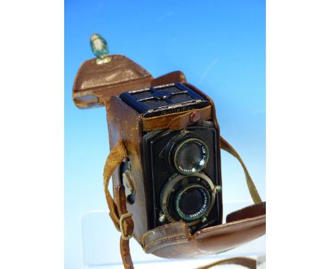 A LEATHER CASED BABY ROLLEIFLEX TWIN LENS CAMERA, No. 149027, POSSIBLY THE 4RF MODEL, WITH 1:2.8 F=6CM LENS.