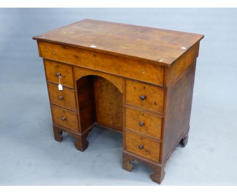 AN EARLY YEW CROSSBANDED WITH OAK PEDESTAL DESK, THE RECTANGULAR LID OPENING ONTO A INSET WRITING SURFACE BEFORE SIX DRAWERS,
