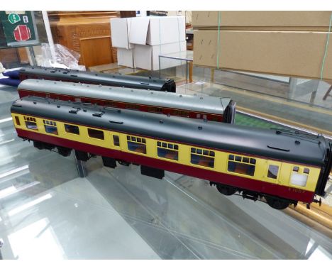 ACCUCRAFT.  A RAKE OF THREE GAUGE 1 MAROON BRAKE, MAROON BUFFET AND MAROON AND CREAM REST WAGON (3).
