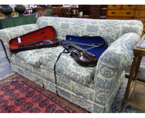 A VICTORIAN THREE SEAT SETTEE UPHOLSTERED IN CREAM PRINTED IN GREY WITH CLASSICAL SUBJECTS, CERAMIC CASTORS.