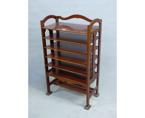 AN ARTS AND CRAFTS STYLE MAHOGANY MUSIC SHELF IN THE MANNER OF SHOOLBRED.   56cm x 31cm x 93cm (H).