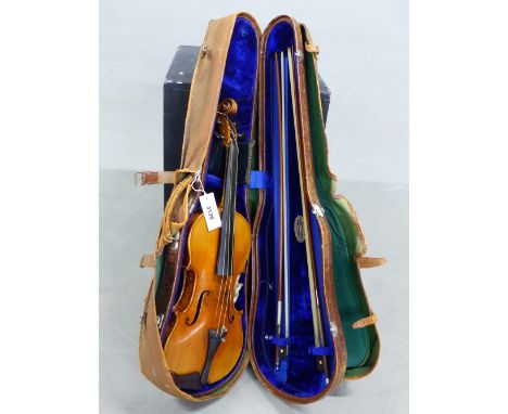 A STRADIVARIUS LABELLED VIOLIN WITH TWO BOWS IN A RUSHWORTH AND DREAPER LEATHER CASE WITH CANVAS OUTER COVER, THE BACK OF THE