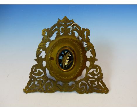 A VICTORIAN EASEL BACKED PIERCED FOLIATE GILT METAL MINIATURE FRAME, THE OVAL DOOR INSET WITH PIETRA DURA FLORAL BLACK GROUND