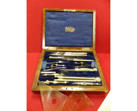 A WALNUT BOXED STANLEY GEOMETRY SET WITH LIFT OUT TRAY, FOUR BONE AND FOUR BOX WOOD RULERS, THE BOX. W 22cms. WITH A LEATHER 