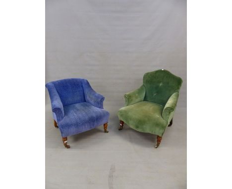 A HOWARD AND SONS AND ANOTHER LOW ARMCHAIR, THE FIRST UPHOLSTERED IN GREEN VELVET WITH SERPENTINE TOPPED BACK ABOVE TURNED MA