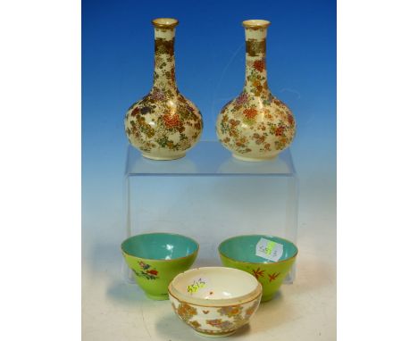 A PAIR OF SATSUMA FLORAL BOTTLE VASES. H 12.5cms. TOGETHER WITH A PAIR OF CHINESE TEA BOWLS, THE INCISED APPLE GREEN EXTERIOR