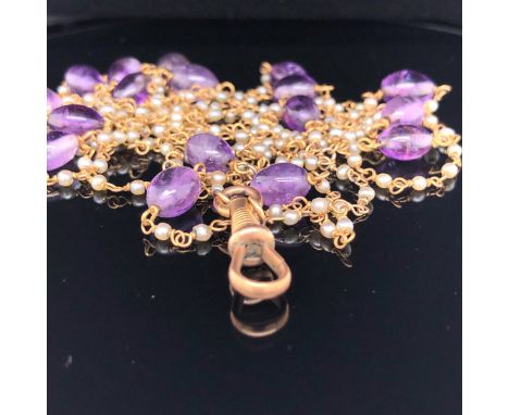 AN EDWARDIAN 14ct GOLD,CONTINUOUS PEARL AND AMETHYST TWISTED WIRE WORK NECKLACE. LENGTH 147cms. GROSS WEIGHT 19.4grms.  