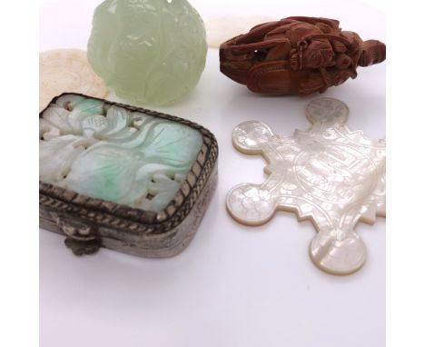 TWO CHINESE MOTHER OF PEARL COUNTERS, A STAR SHAPED SILK SPOOL, A COQUILLA NUT MONKEY RIDING A HORSE, A WHITE METAL SNUFF BOX