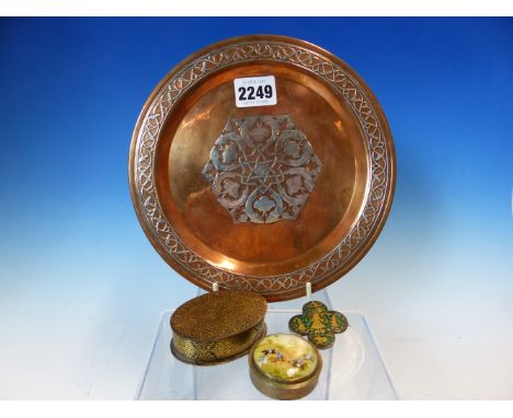 A SILVER DAMASCENED COPPER PLATE.   Dia 20cms. A GREEN ENAMEL QUATREFOIL BROOCH GOLD INLAID WITH A DEITY, ELEPHANT AND ATTEND