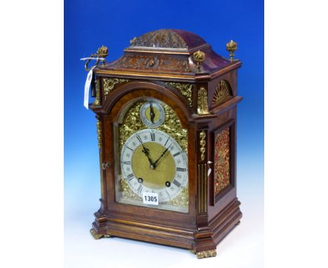 LENZKIRCH, A BURR WALNUT CASED MANTEL CLOCK, THE PENDULUM MOVEMENT CHIMING ON TWO COILED RODS, THE SILVERED CHAPTER RING BELO