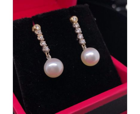 A PAIR OF YELLOW GOLD CULTURED PEARL AND DIAMOND DROP EARRINGS. GROSS WEIGHT 1.7grms.