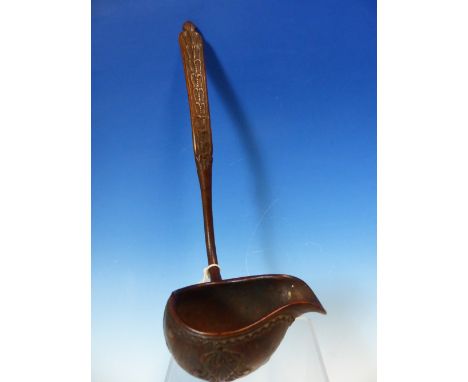 A VINTAGE TREEN PUNCH LADLE, POSSIBLY SCANDINAVIAN, THE HANDLE CARVED WITH A BAND OF BICUSPID LEAVES, THE PAP BOAT SHAPED BOW