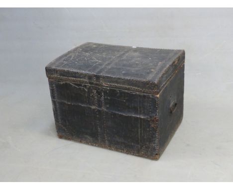 A LEATHER COVERED TEAK TRUNK, THE CLOSE NAILED METAL STRAPS ON THE HINGED LID, IRON HANDLES. W 65 x D 47 x H 46cms.