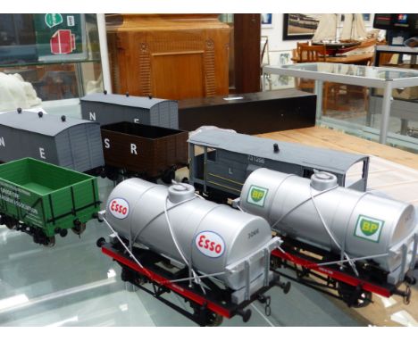 SEVEN VARIOUS GAUGE 1 WAGONS TO INCLUDE GUARDS VAN, ESSO AND BP TANKERS, TWO BOX WAGONS AND TWO OPEN FREIGHT (7).