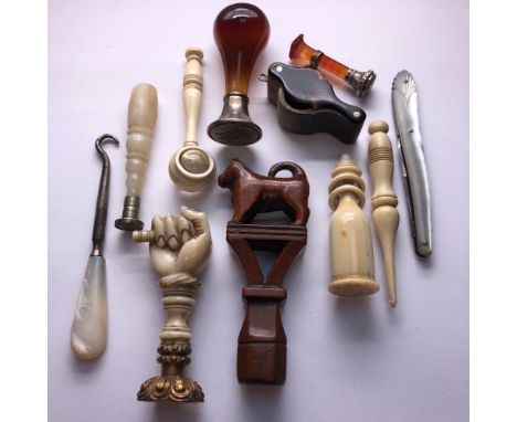 A COLLECTION OF FIVE VARIOUS SEALS, TWO MAGNIFYING GLASSES, TWO BONE SEWING ITEMS, A MOTHER OF PEARL HANDLED BUTTON HOOK AND 