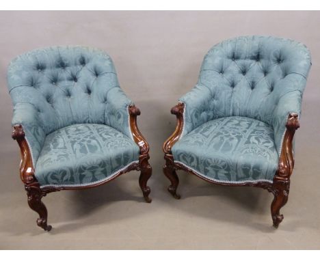 A PAIR OF VICTORIAN CARVED MAHOGANY ARMCHAIRS UPHOLSTERED IN DEEP TURQUOISE DAMASK. SCROLLS BELOW THE ARM HANDLES, THE CABRIO