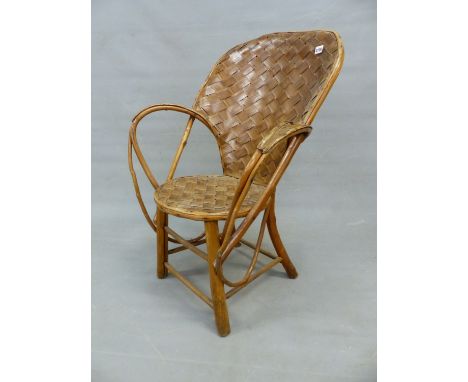 A WOVEN SPLIT WALNUT AND RUSTIC BENTWOOD ELBOW CHAIR, THE HOOP BACK AND CIRCULAR SEAT OF WOVEN LATHS, THE SWERLING OPEN STICK