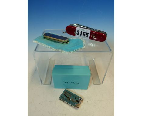 A TIFFANY SILVER MOUNTED TWO BLADE PENKNIFE WITH SCISSORS, TWEEZERS AND TOOTHPICK.   W 6cms. A SWISS-TECH FOLDING PLIERS, THE