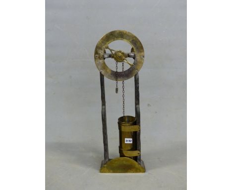 AFTER S SMYTHES 1700 WATER CLOCK, THE BRASS DIAL AND WATER DRUM MOUNTED BETWEEN TWO WOODEN PLANK SIDES. H 62cms.