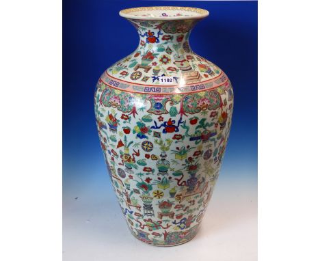 A CHINESE FAMILLE ROSE OVOID VASE DECORATED WITH FLOWERS AND SCATTERED PRECIOUS OBJECTS, SEAL MARK IN BLUE. H 60cms.