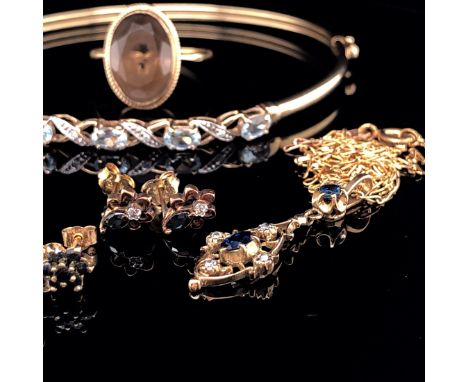 A 9ct GOLD SAPPHIRE AND DIAMOND PENDANT AND EARRING SET TOGETHER WITH A 9ct GOLD AQUAMARINE AND DIAMOND BANGLE, A 9ct GOLD SM