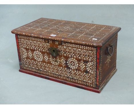 AN ISLAMIC HARDWOOD BOX, THE RECTANGULAR HINGED LID INLAID WITH A CHEQUERBOARD OF MOTHER OF PEARL.   W 62 x D 33 x H 31cms.
