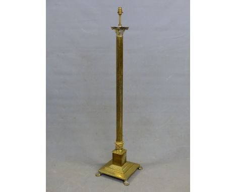 A BRASS CORINTHIAN COLUMN LAMP STANDARD SUPPORTED ON STEPPED SQUARE FOOT. H 138cms.