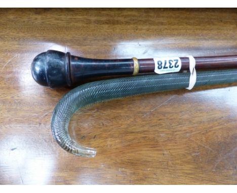 A WALKING CANE WITH SCREW TOPPED SNUFF BOX HANDLE TOGETHER WITH A GLASS WALKING STICK