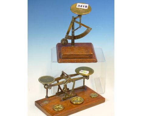 TWO LETTER SCALES, THAT WITH WOODEN BASE WITH THREE BRASS WEIIGHTS, THE OTHER ON LEATHER BASE WITH A STAMP BOX BEFORE IT, THE