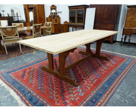 A PUGINESQUE OAK TABLE, THE RECTANGULAR TOP UNPOLISHED, THE POISHED ARCH SUPPORT JOINED TO TWIN PILASTER TRESTLE ENDS. W 242 