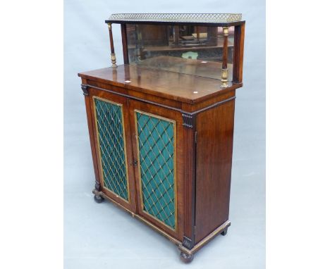 A 19th C. ROSEWOOD SIDE CABINET, THE MIRRORED BACK BELOW A BRASS GALLERIED SHELF, THE DOORS BELOW WITH BRASS GRILLES OVER GRE