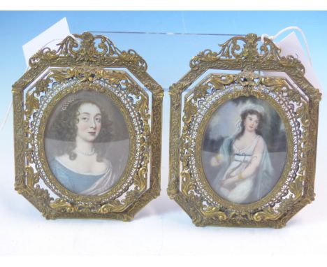 THREE DECORATIVE PORTRAIT MINIATURES OF LADIES, TWO IN EASEL BACKED BRASS FILIGREE FRAMES AND THE OTHER IN AN OVAL FRAME MOUN