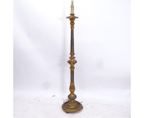 A painted and gilt standard lamp, with spiral turned fluted column, height to top of bayonet fitting 161cm 