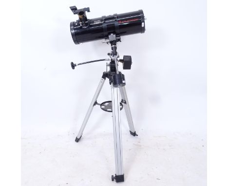 A Celestron Firstscope 114 compact telescope, on tripod stand 