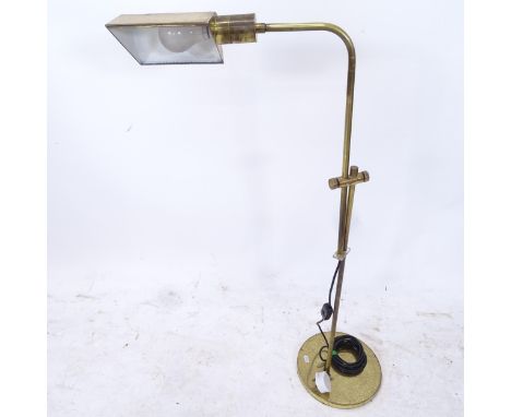 A telescopic brass floor standing reading lamp 