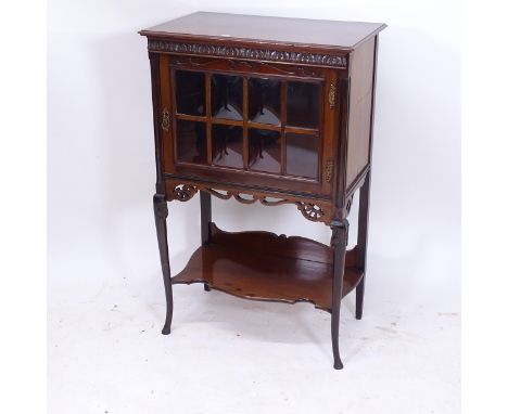 An Edwardian mahogany music cabinet, with lattice-glazed door and shelf under, on cabriole legs, W61cm, H98cm, D39cm 