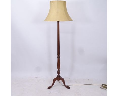 A mahogany fluted standard lamp and shade, on a carved tripod base, height to bayonet fitting 160cm 